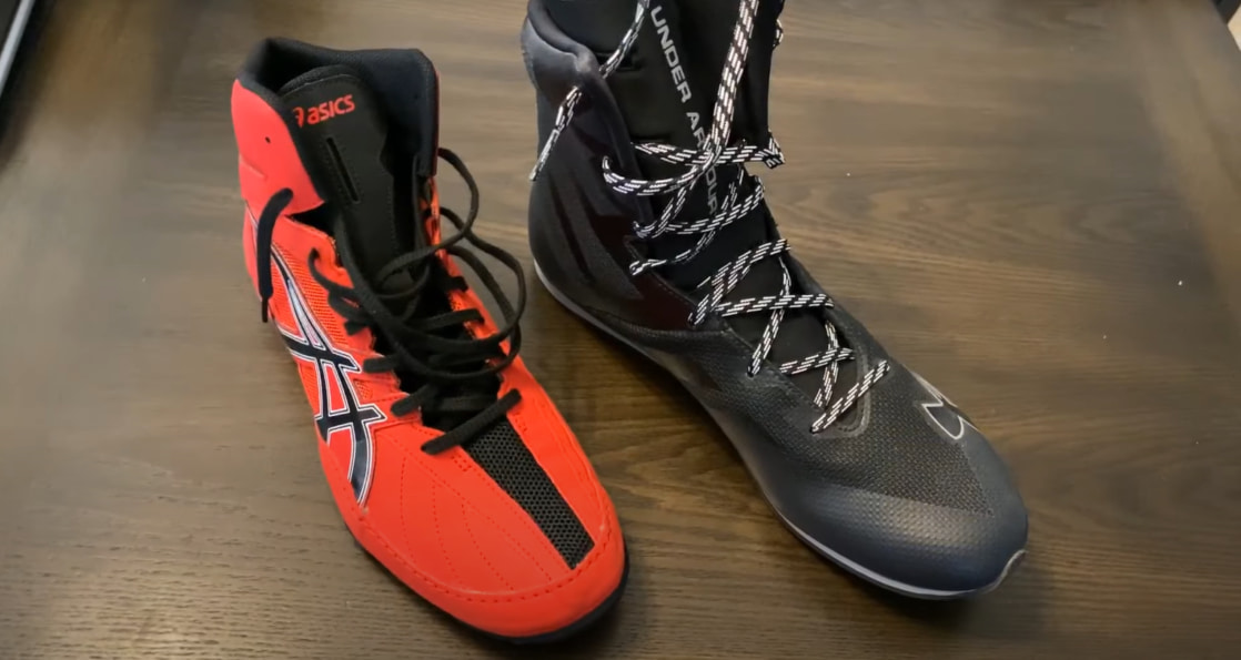 Two pairs of wrestling shoes, red and black