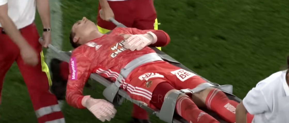 A football player is carried on a stretcher