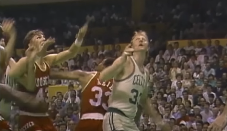 Larry Bird playing basketball on court