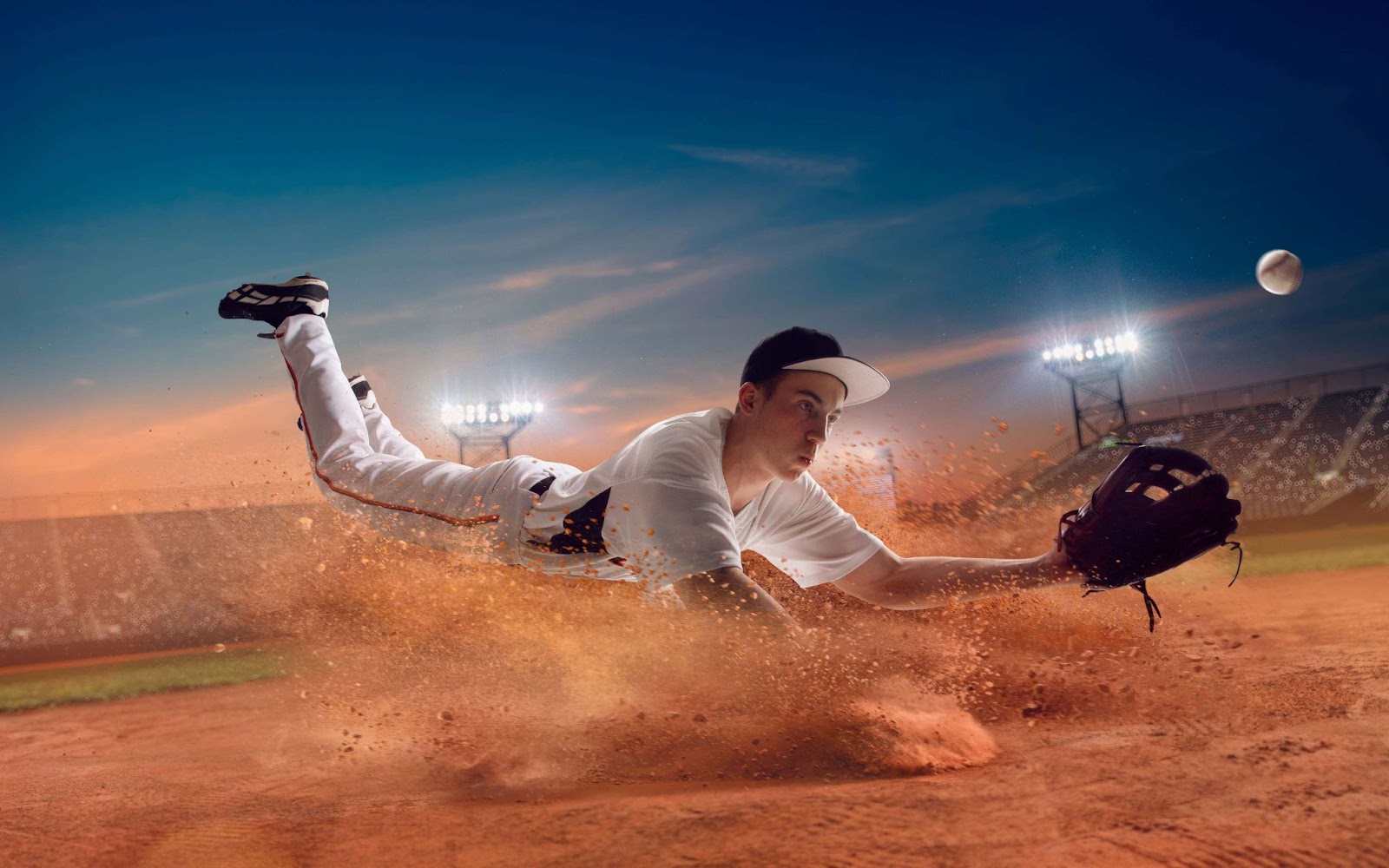 A man catching a baseball