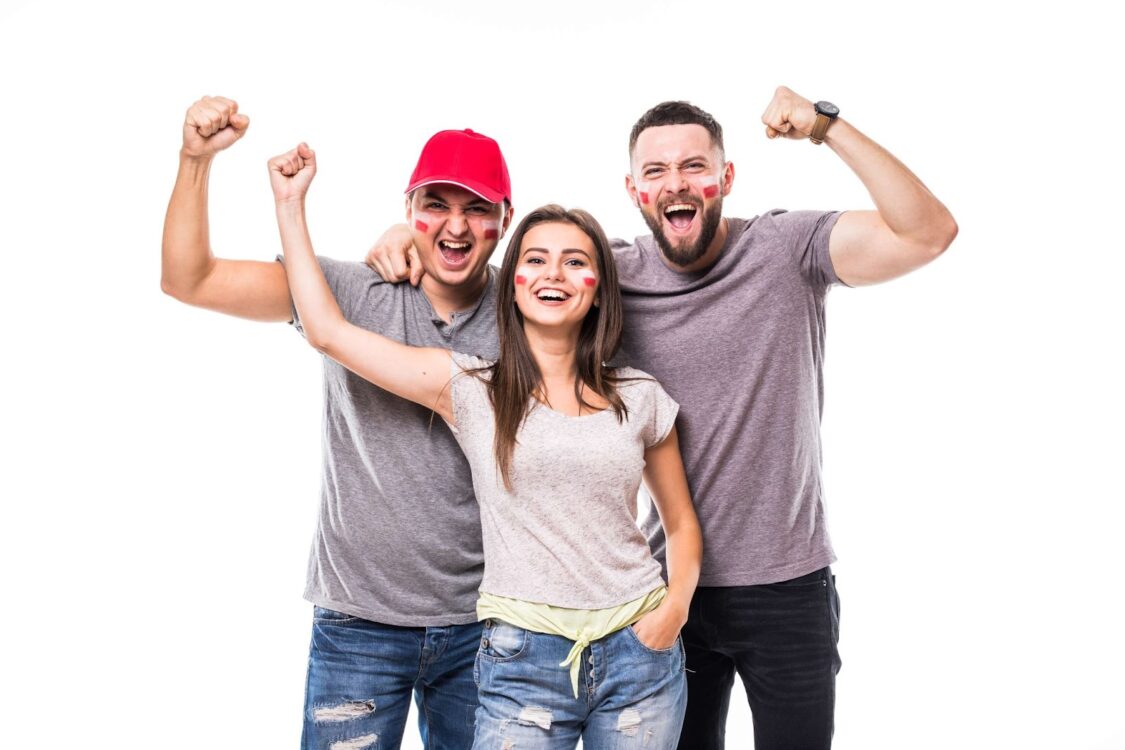 Three people cheering for their team